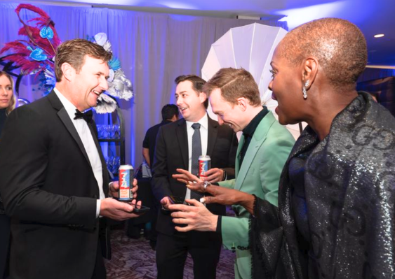 Trigg Watson performing close-up magic at a holiday event