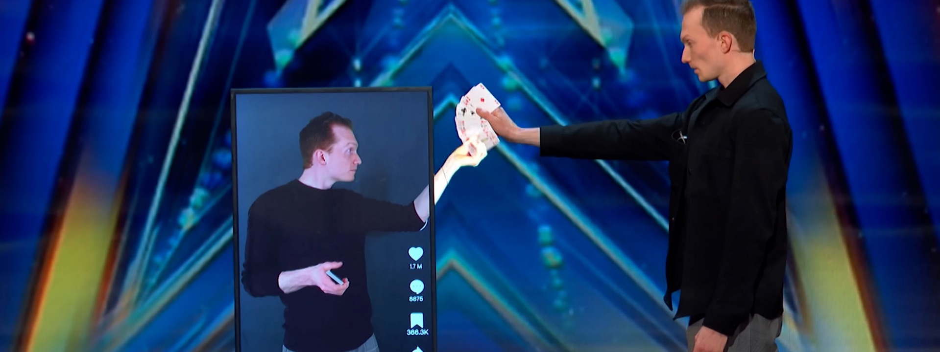 Trigg Watson pulling cards through a digital screen on America's Got Talent